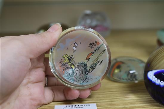 A collection of six paperweights